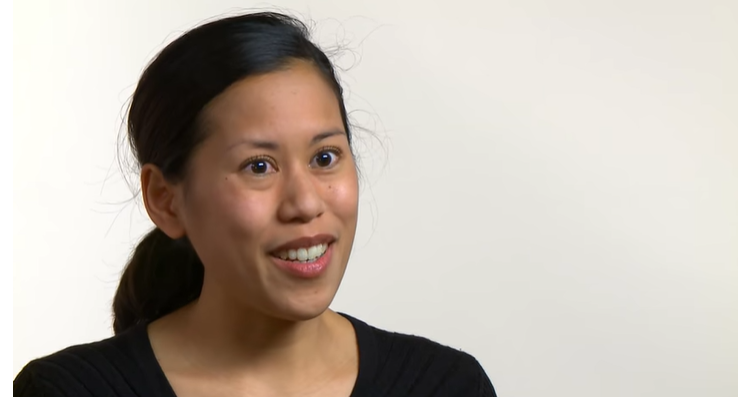A young woman with black hair in a ponytail talks about her MS fatigue.